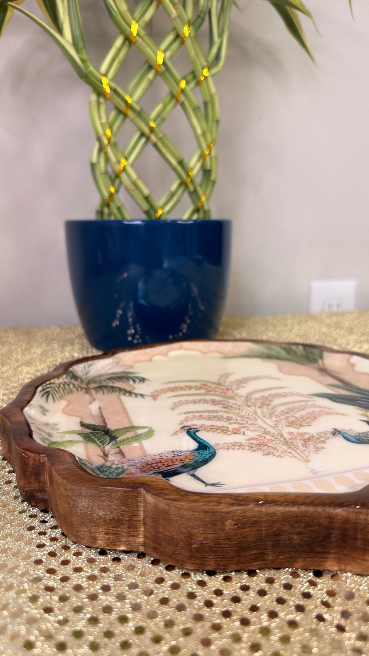 Peacock print scalloped wooden serving platter, angled view