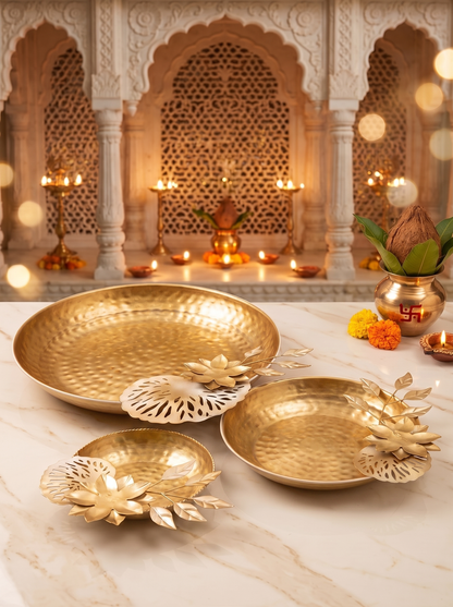 Gold lotus bowl and leaf tealight holder set of 3, front view in a festive setting
