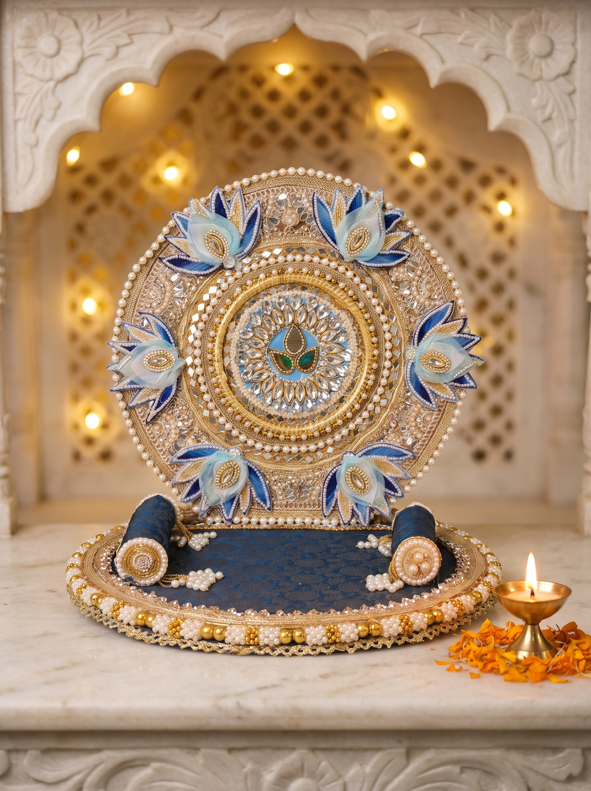 Blue lotus round-back singhasan for Laddu Gopal with silver zari, front view in a marble mandir setting