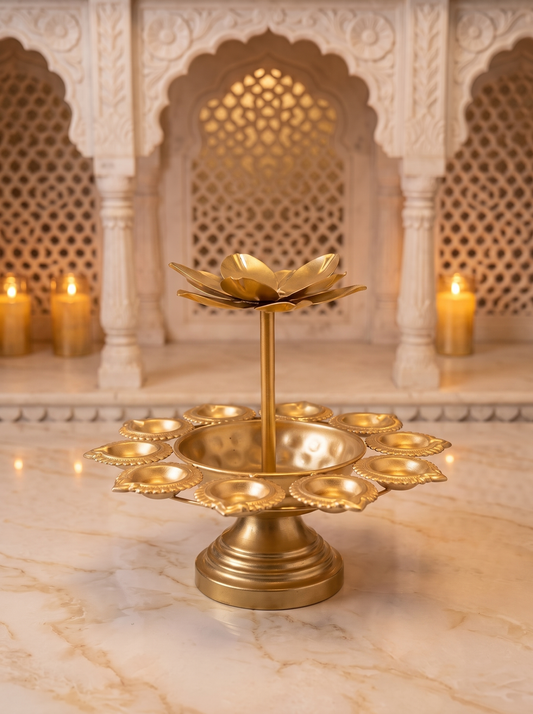 Gold lotus 2-tier tealight stand with 8 diya cups on pedestal base, front view in a festive setting