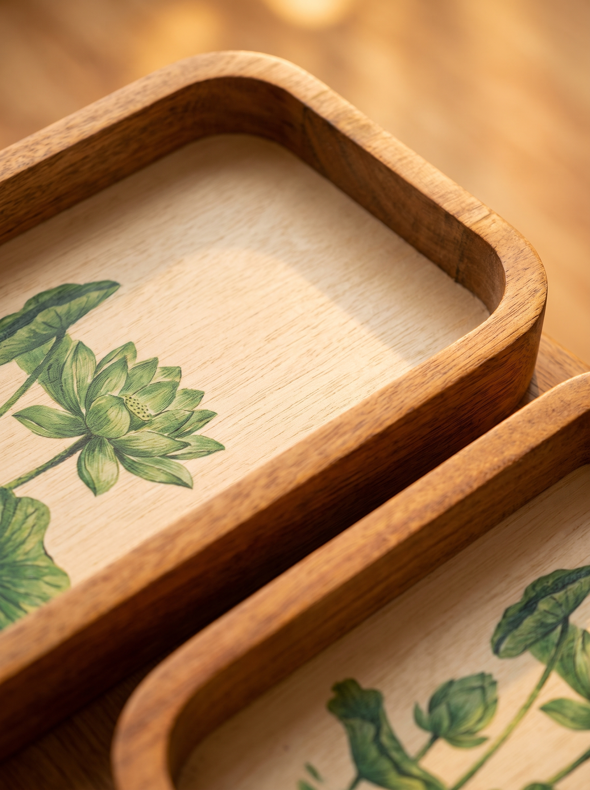 Close-up detail of palm tree print under resin on whitewashed mango wood tray