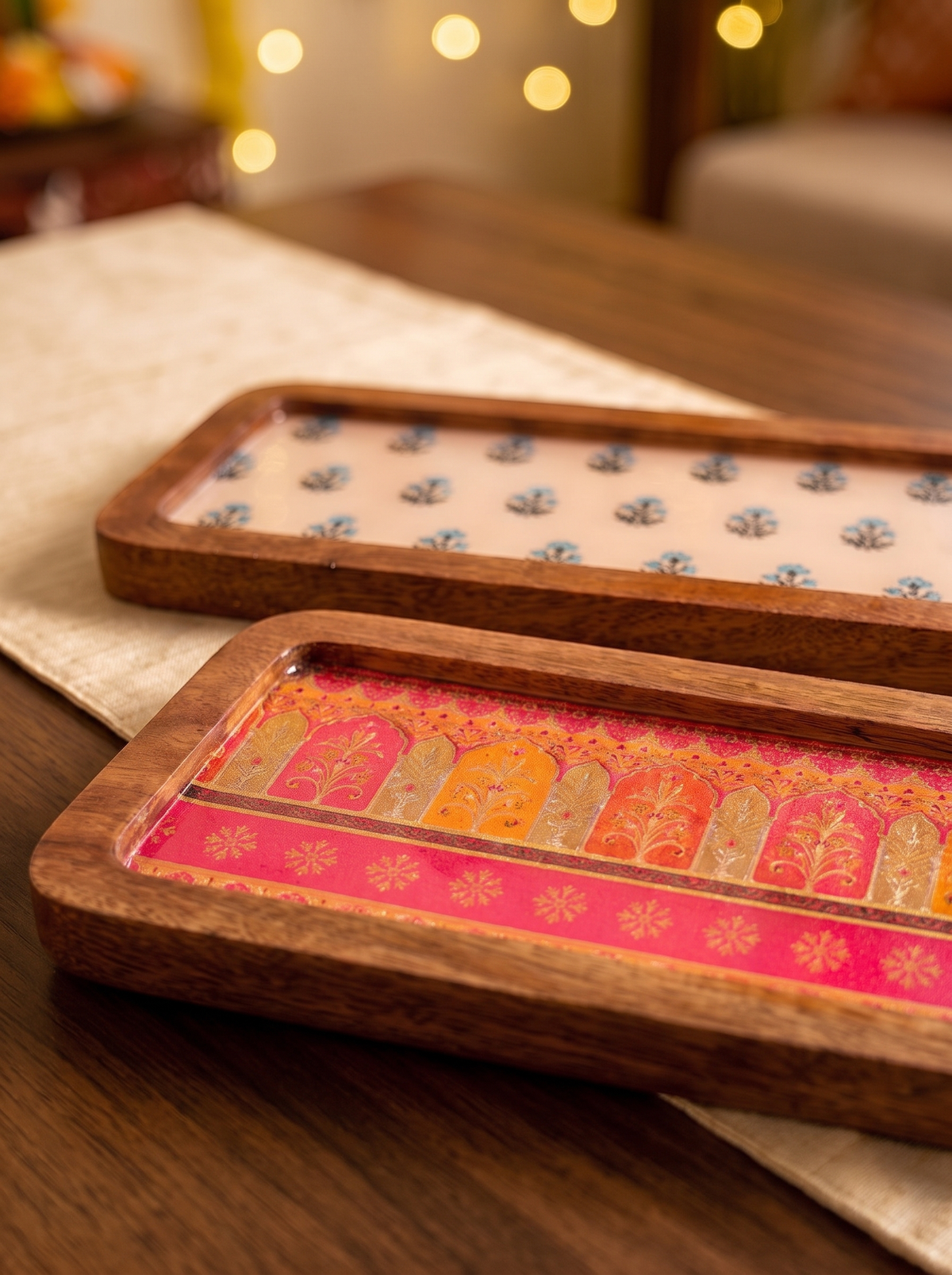 Close-up detail of printed inlay on wooden serving board with handle