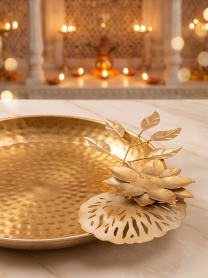 Close-up detail of gold lotus petal bowl and leaf tealight holder