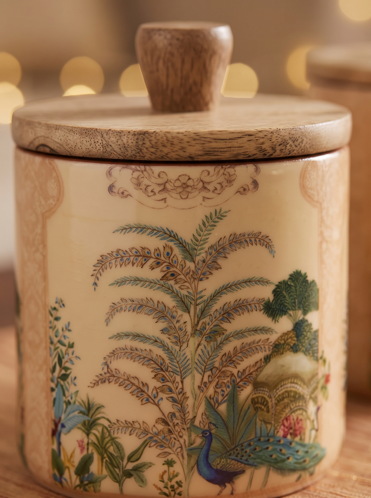 Close-up detail of Mughal garden print on cream wooden canister jar