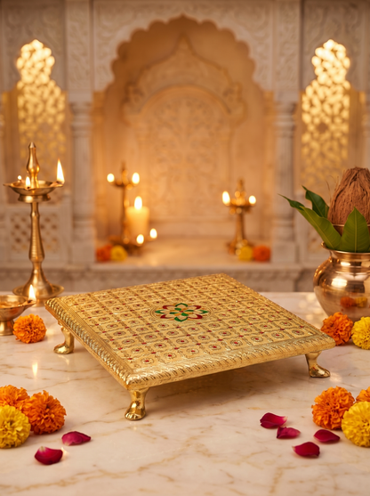Gold brocade square bajot chowki, angled view with diyas and marigolds