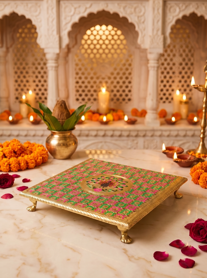 Pink green brocade bajot chowki, angled view with diyas and marigolds