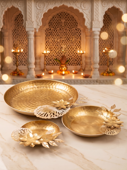 Gold lotus bowls and leaf tealight holders, angled view with marigolds