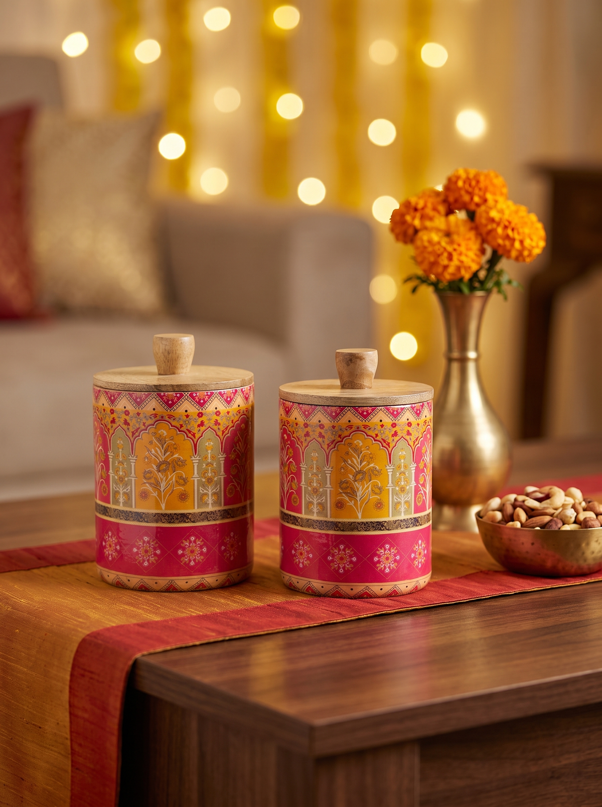 Pink and saffron Mughal print wooden canisters styled and filled with dry fruits for Diwali gifting