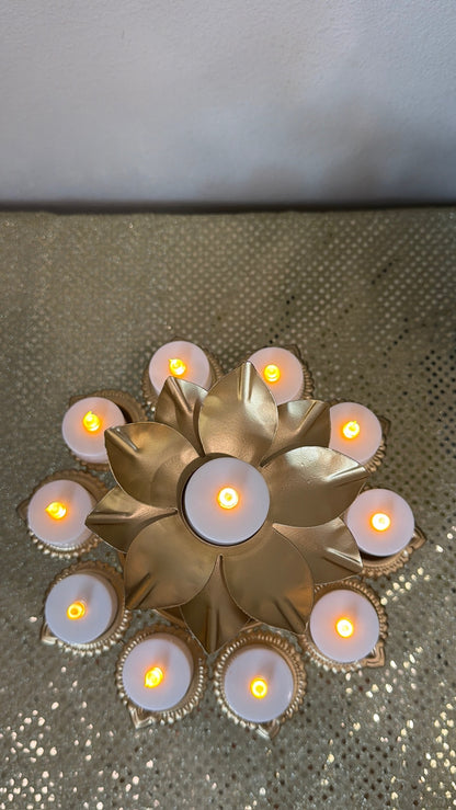 Top view of gold lotus tealight stand with eight diya cups