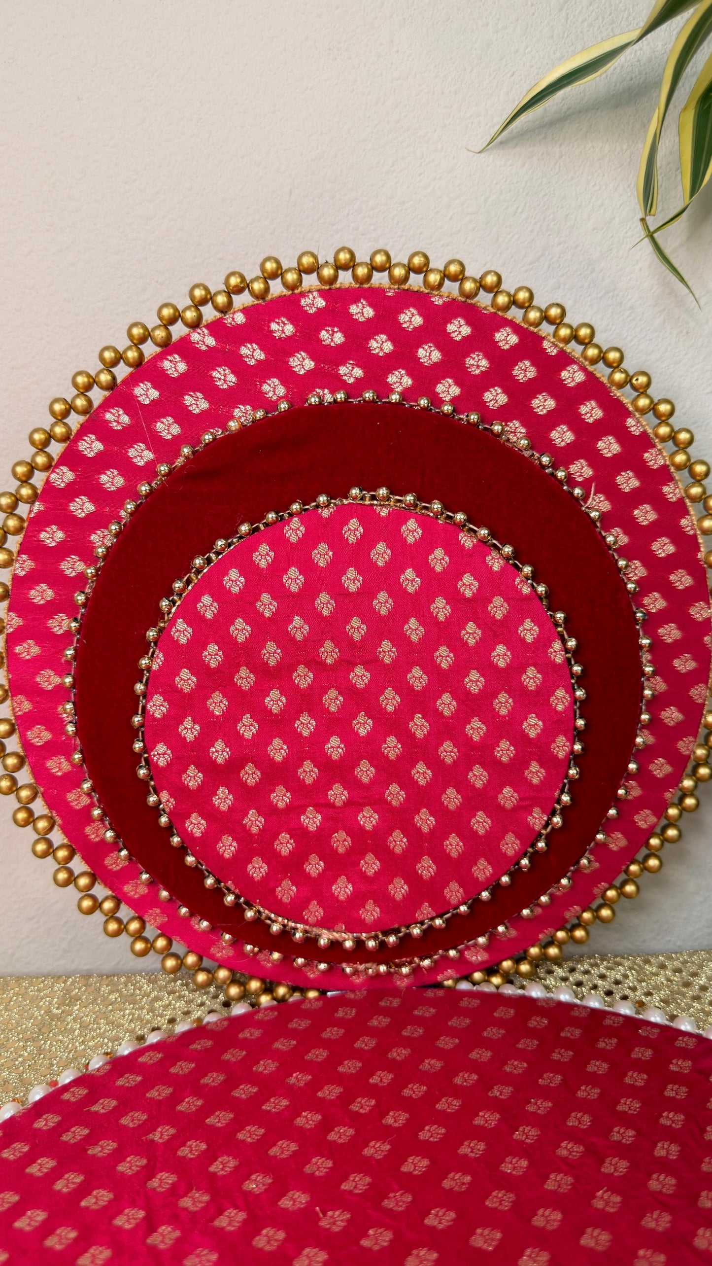 Detail of gold bead edge on pink brocade gifting trays