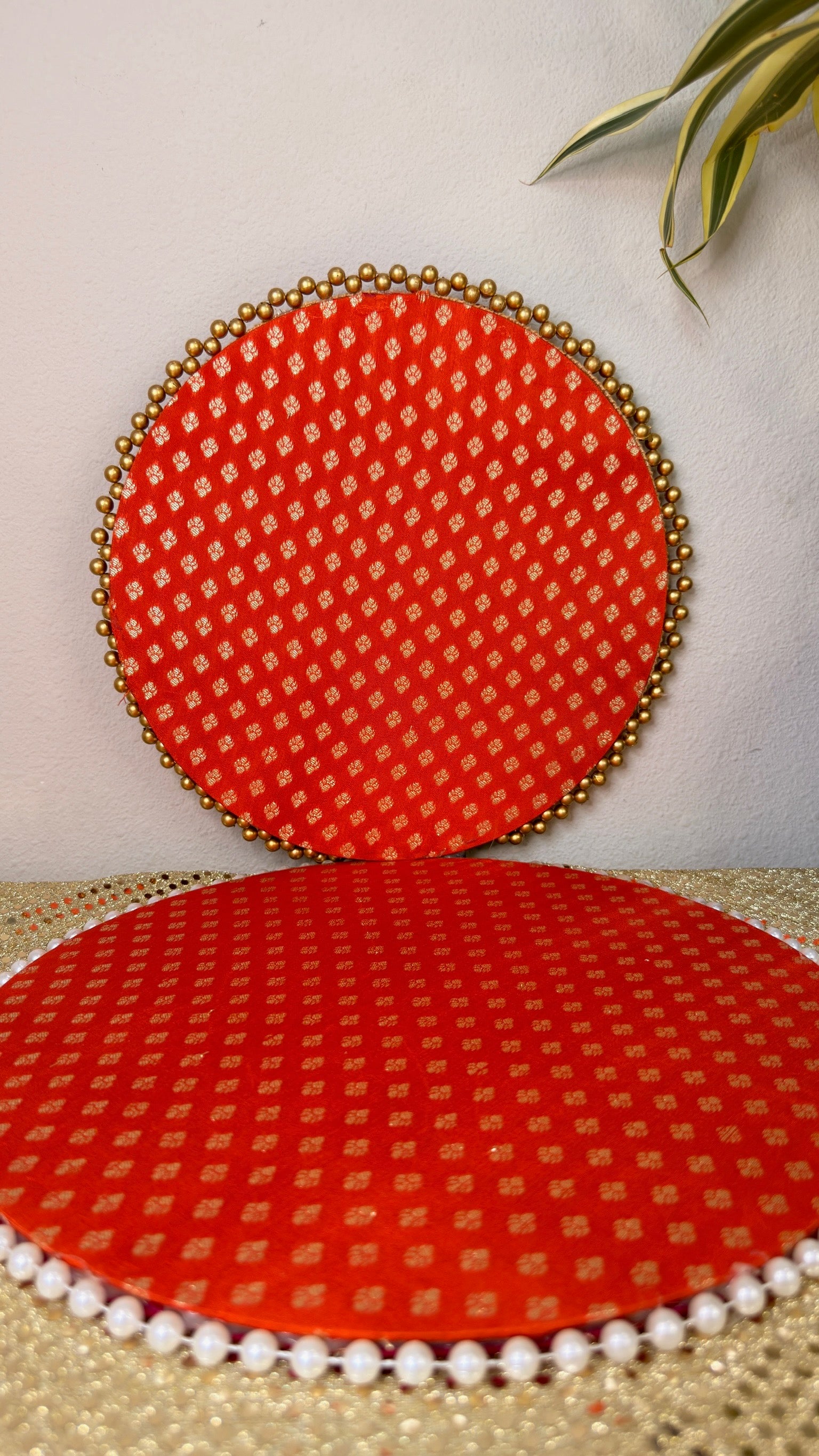 Red brocade decorative thali with gold bead rim, front view