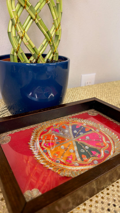 Embroidered mandala wooden serving tray with glass top, angled view