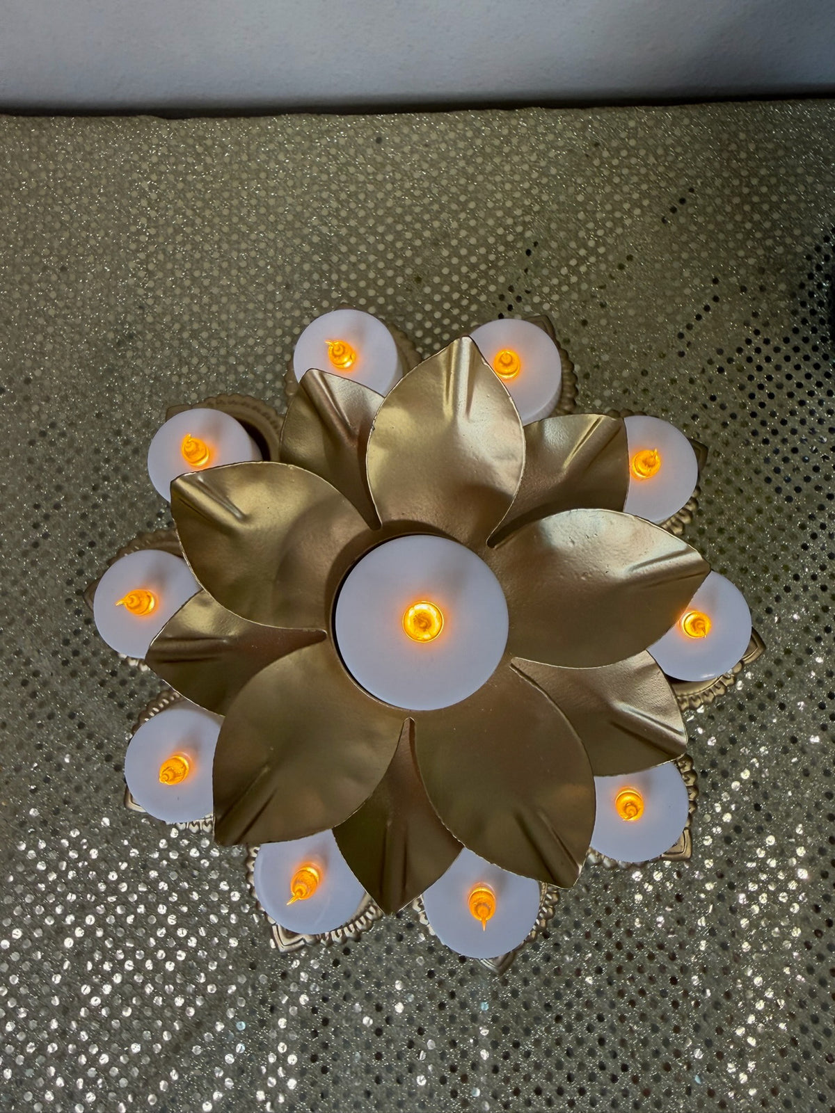Overhead view of gold lotus pedestal diya stand