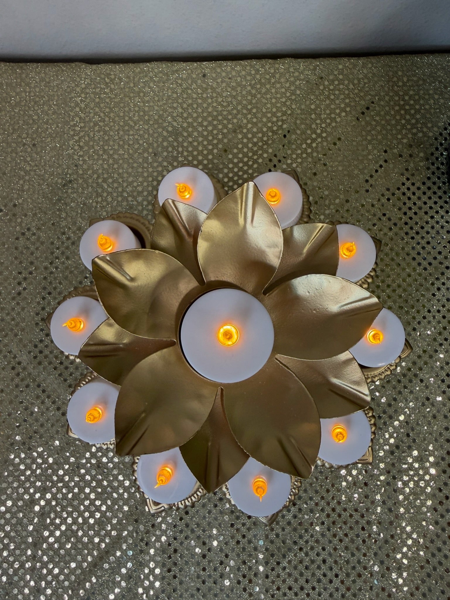 Overhead view of gold lotus pedestal diya stand