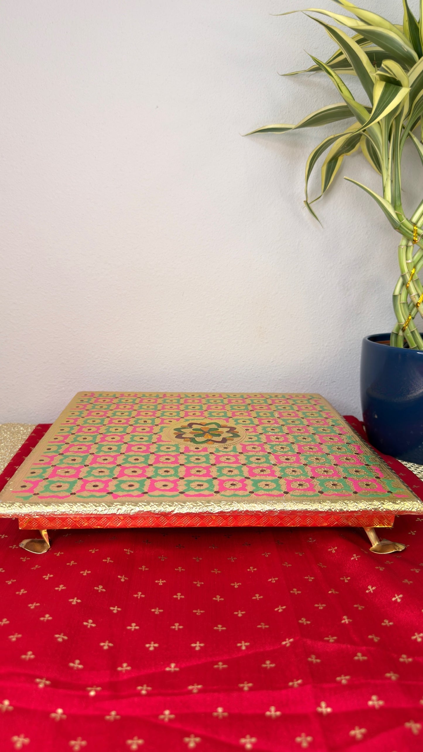Pink and green checkered brocade puja chowki, square bajot with gold feet for Diwali puja
