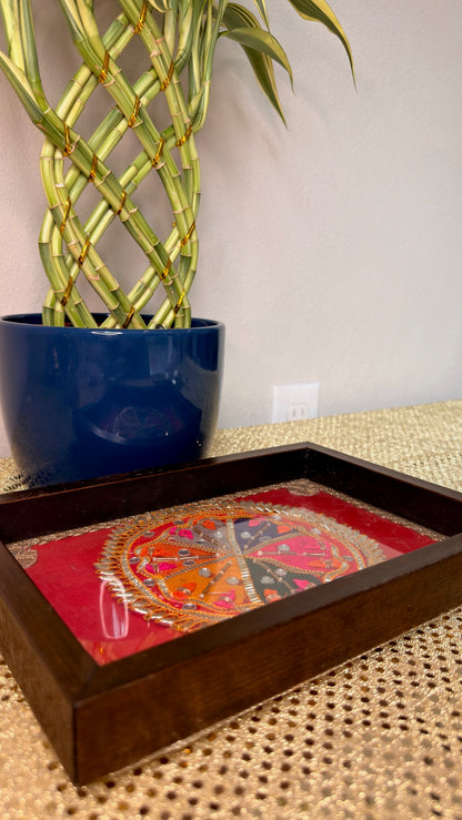 Red mandala embroidered wooden tray styled beside a plant, Diwali gift tray