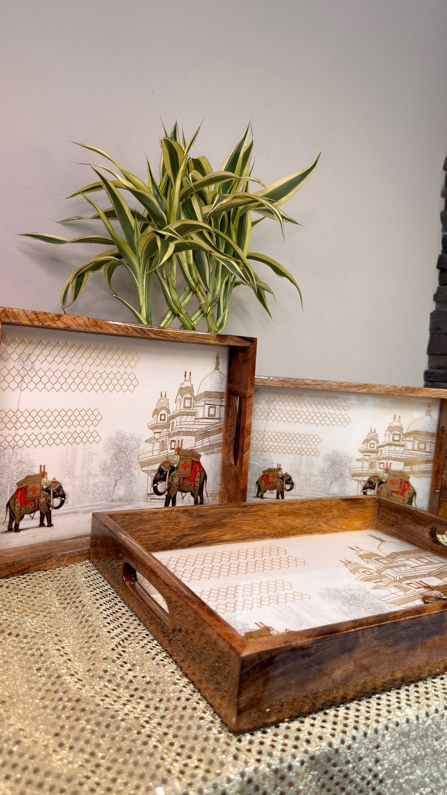 Elephant and palace print wooden nesting trays, angled view