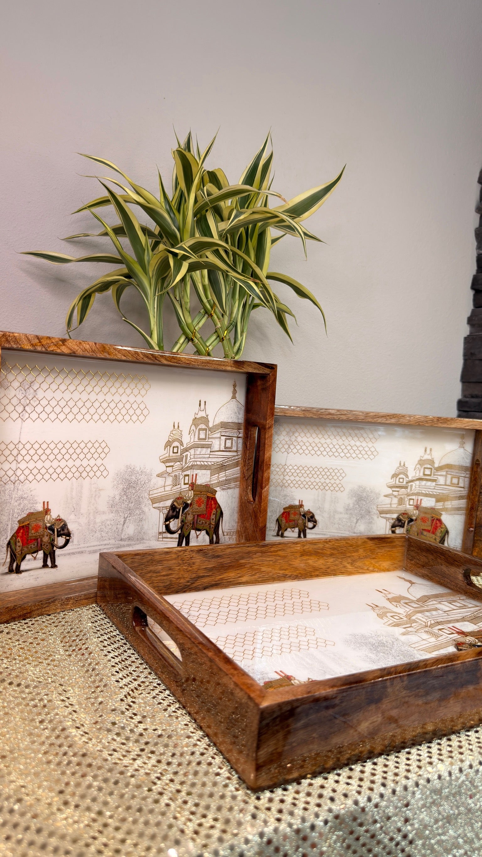 Elephant and palace print wooden nesting trays, angled view