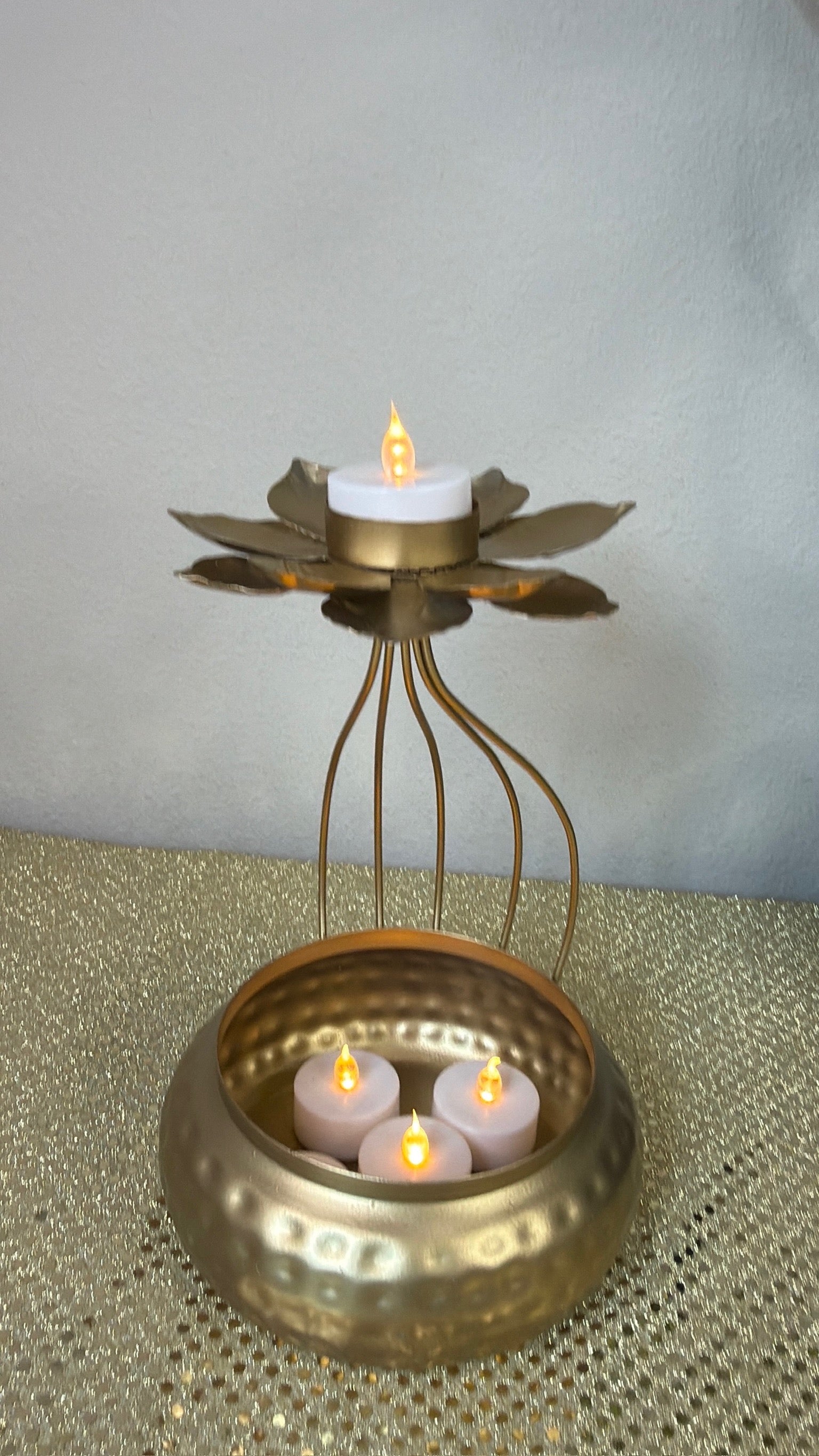 Gold hammered urli pot with wire cage and lotus tealight holder on top, Diwali centerpiece
