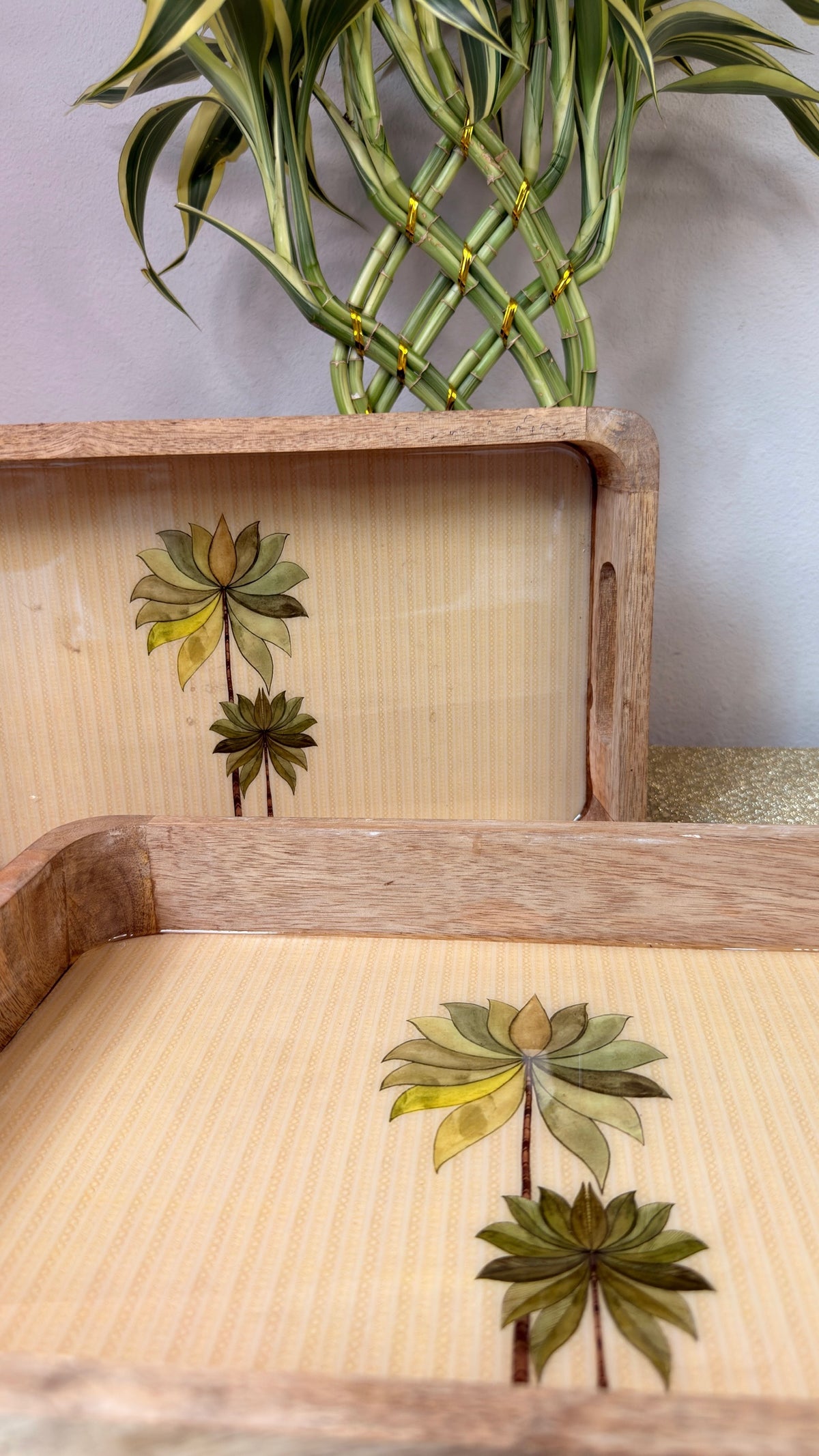 Detail of palm print under glossy resin finish on mango wood tray